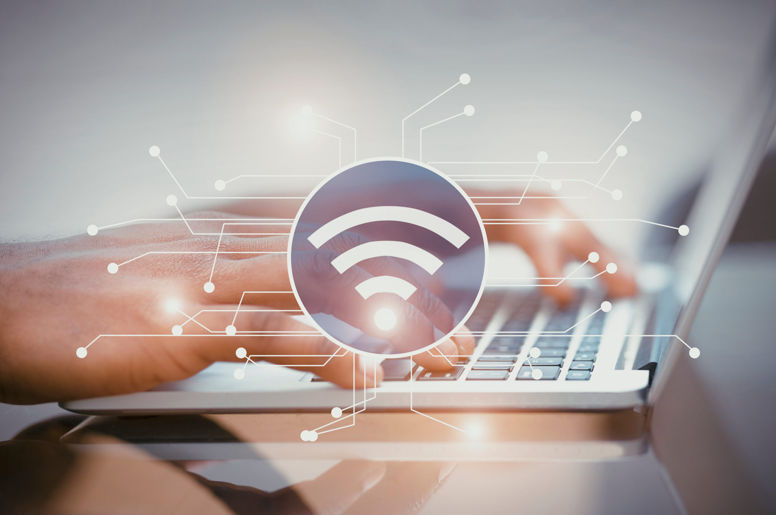 Illustration of wifi icon with electronic connections, woman's hands using laptop on background.