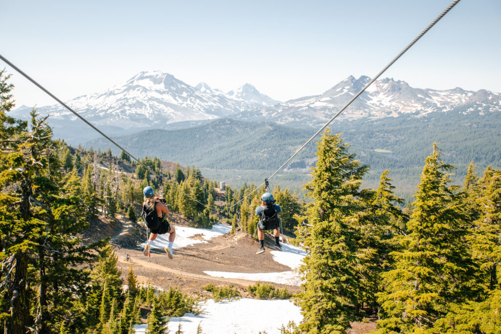 Couple doing zipline at Mt. Bachelor